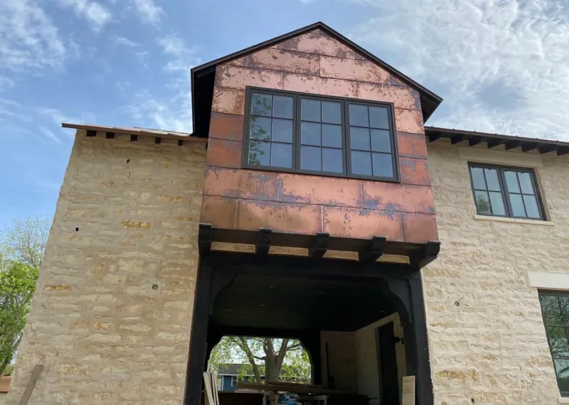 Copper metal panel facade on a stone building for Metal Roof Coating in Palos Hills